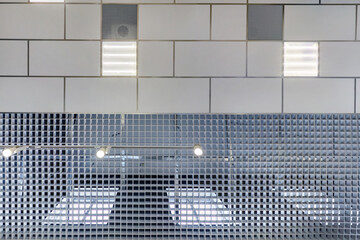 Obraz premium cassette suspended ceiling with square halogen spots lamps and drywall construction in empty room in apartment or house. Stretch ceiling white and complex shape. Looking up view