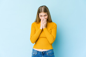 Young blonde woman isolated on blue background making up plan in mind, setting up an idea.