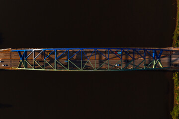 This is an aerial view of the Fort Henry Arch Bridge that carries Interstate 70 and US Routes 40 and 250 over the still blue waters of the Ohio River in Wheeling, West Virginia.