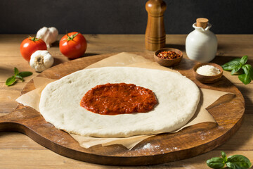 Preparing Homemade Uncooked Cheese PIzza