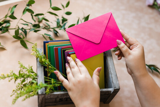 they took out a pink envelope from the stack