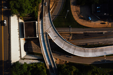 This is a top-down aerial of the complicated tangle of highway ramps for Interstate 70 that feed...