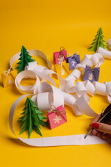 Long twisted expanded letter for Santa Claus. Copy space. yellow background.