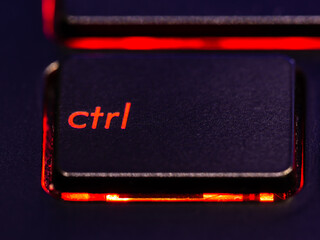 Black keyboard control key with red backlight