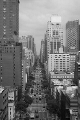 View through completely manhatten an endless canyon of houses with streets and the new york traffic. great view through the high skyscrapers. black and white picture