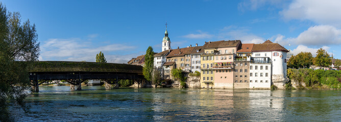 view of the Aare river and the historic old town of Olten and wooden bridge