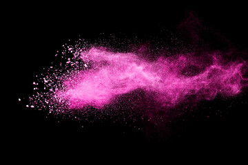 Pink powder explosion on black background. Paint Holi.
