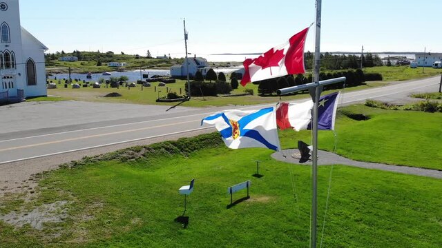 Canadian, Nova Scotia and Acadian flags in Larry's River, Nova Scotia