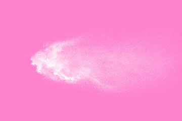 White powder explosion on pink background. Paint Holi.