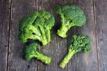 Group of Broccoli heads on a wooden background