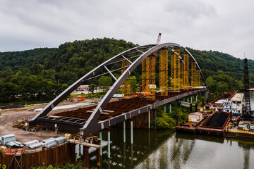 The Wellsburg Bridge is a tied-arch bridge under construction between Brilliant, Ohio and Wellsburg, West Virginia.