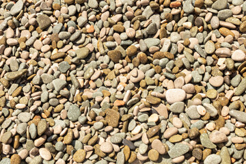 Natural background from colored and wet sea pebbles
