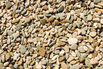 Natural background from colored and wet sea pebbles