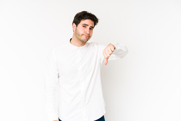 Young man isolated on white background showing thumb down, disappointment concept.
