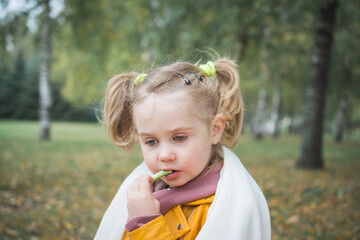 little child three year old girl playing in the park