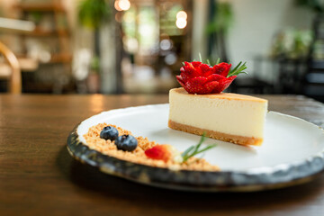 Close-up picture of delicious cakes on beautifully decorated ceramic plates and bokeh background.