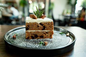 Close-up picture of delicious cakes on beautifully decorated ceramic plates and bokeh background.