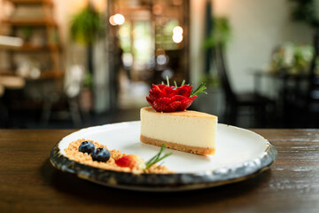 Close-up picture of delicious cakes on beautifully decorated ceramic plates and bokeh background.