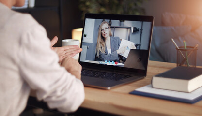 Back view of impersonalized person having distant communication with business partner through video...