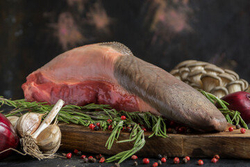 raw beef tongue on a chopping Board. © Julia Sedaeva 