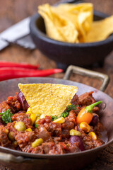 chili con carne on wood