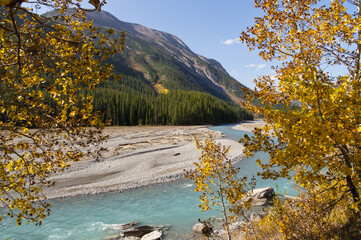 A River Flowing by the Mountains in Autumn