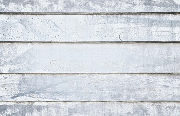 Old white wooden background with wood worm holes.