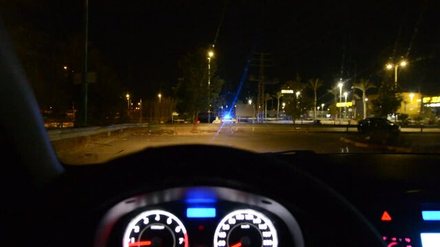 low light soft focus. views from the car to the police checkpoint quarantine coronavirus at night. 