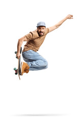 Full length shot of a guy with a cap jumping with a skateboard - obrazy, fototapety, plakaty