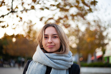 Portrait of a beautiful blonde woman in a coat. Autumn photo.
