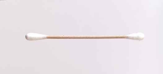 White cotton buds in a plastic container isolated on a white background