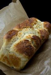 homemade french brioche on dark background