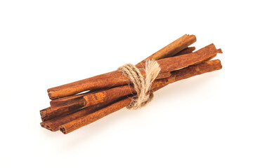 Cinnamon sticks heap isolated on white