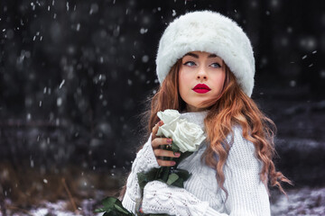 Beautiful girl in a white fur hat in the forest. Fabulous photo. Russian. In the role of Anna Karenina. New Year's, snowy photo session.