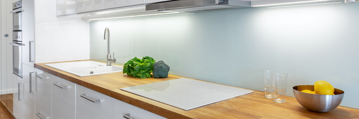 Elegant white kitchen with led lights, panorama