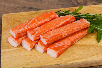 Crab stick surimi over board