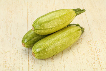 Young tasty zucchini over board
