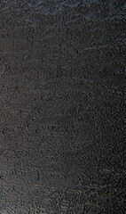 Black texture background. The dark embossed background.