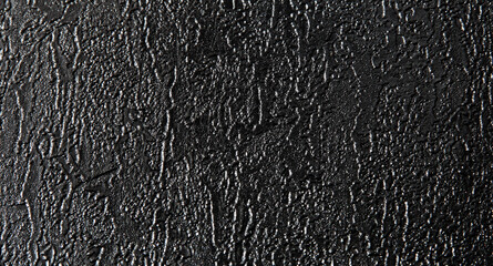Black texture background. The dark embossed background.