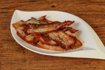 Roasted juicy bacon in the plate