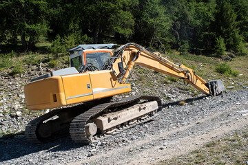 An excavator on a forest road