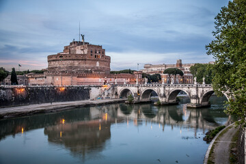Castel Sant'angelo and the bridge of Sant'angelo across the Tiber in Rome on a may evening. Rome,...
