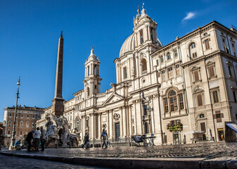 Fototapeta premium Navona square, St. Agnes Church and the fountain of the Four rivers in Rome on a Sunny may morning. Rome, Lazio, Italy