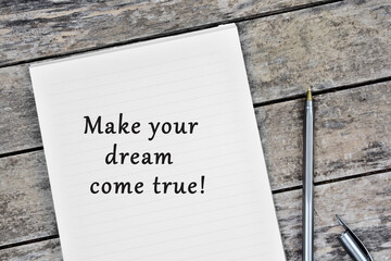 Text Make your dream come true on notebook page