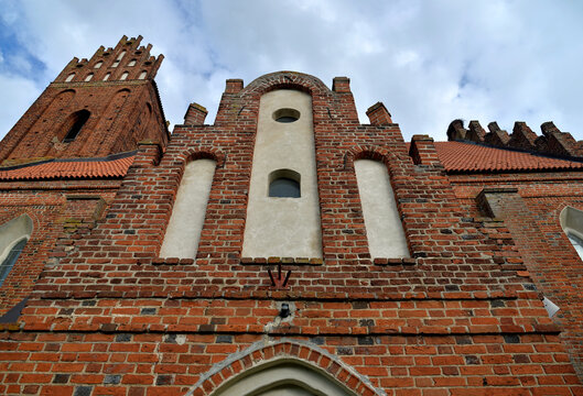 built at the end of the 14th century in the Gothic style, the Catholic Church of Our Lady of Victory in Łabędnik in Warmia and Masuria, Poland September 2020 general views and close-ups of architectur