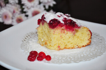 A piece of homemade curd pie with raspberries on a plate