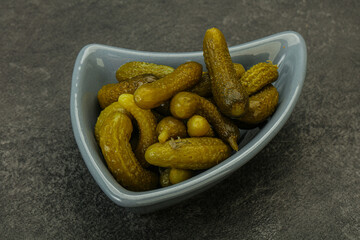 Pickled gherkin in the bowl