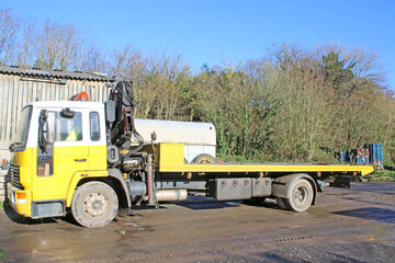 Recovery Truck in a yard	
