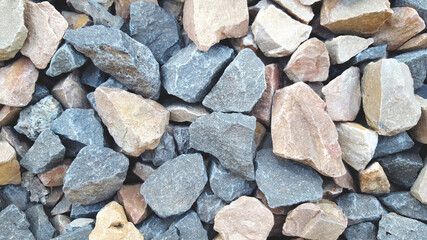 grey and yellow gravels background, Construction materials granite stones texture close up.