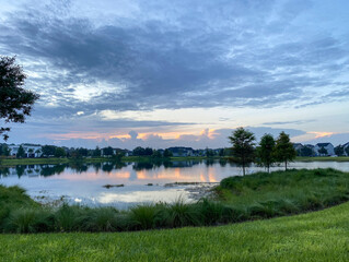 Fototapeta na wymiar Beautiful pink, orange and blue sunset reflecting on a lake